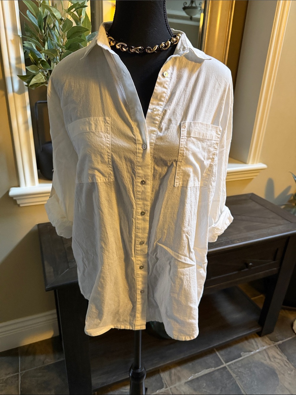 Ispiri brand white button blouse with rolled/buckle detail sleeves.